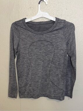 Gray lululemon Swiftly Tech Long Sleeve Crew features signature Silverescent